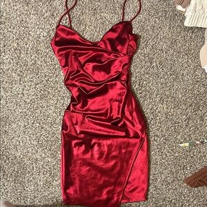 Red, shiny dress. Thigh slit and V neck